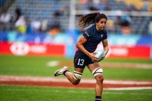 Sarah Levy running with the rugby ball.