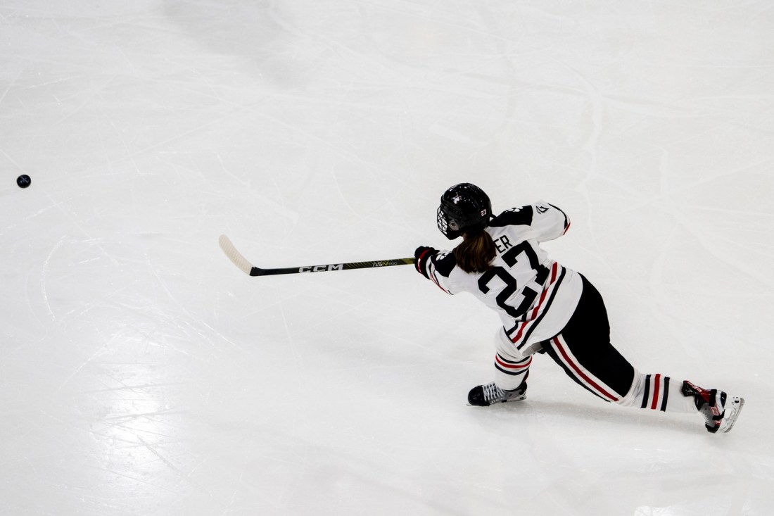 Megan Carter taking a shot in the Hockey East Championship game.