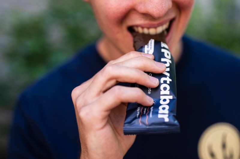 A person eats a seaweed protein bar from Phytabar.