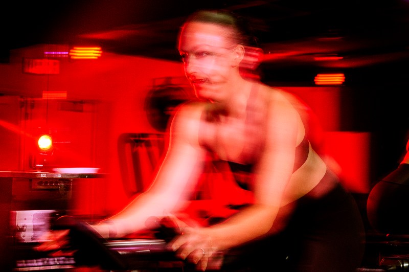 Blurred image of Meaghan St Marc on a cycling bike. 