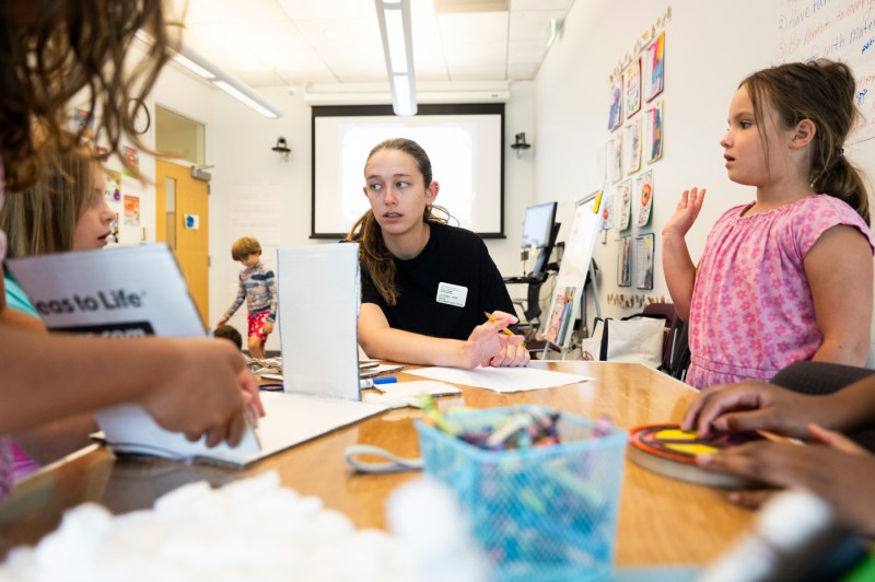 Leanna Prip working with a student in the Word Detectives summer reading program.