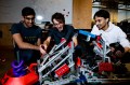 Students working on a robot in robotics club.