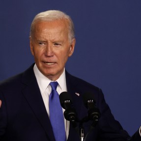 Joe Biden speaking at a podium.