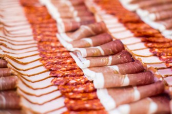Rows of cold cut meats.