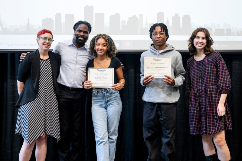 Youth Interns holding awards.