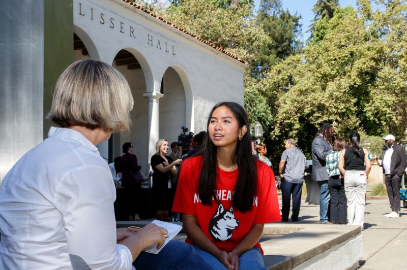 A student talking to a reporter at the Oakland Opportunity Scholarships press conference.