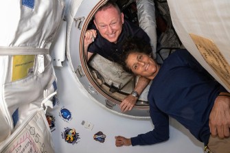 Boeing astronauts pose inside the Starlinger spacecraft in June.