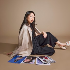 Kat Tse posing for a photo in a studio.