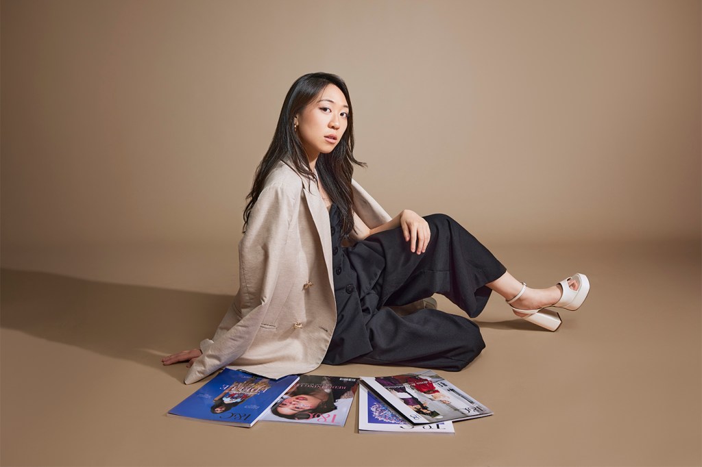 Kat Tse posing for a photo in a studio.