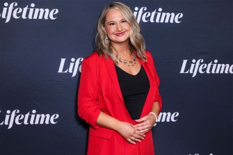 Gypsy Rose Blanchard wearing a red blazer and black shirt at a Lifetime event.