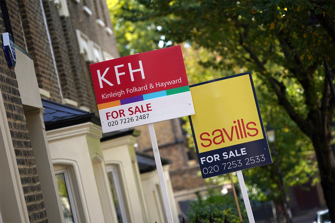 Estate agent signs in London.