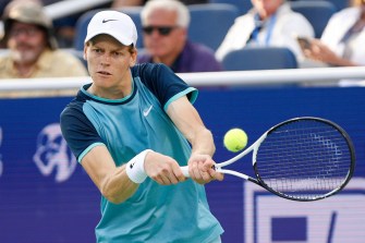 Jannik Sinner hitting the tennis ball