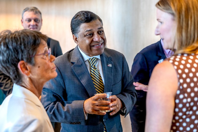 Dr. Rahul Gupta speaks to people at a fireside chat.