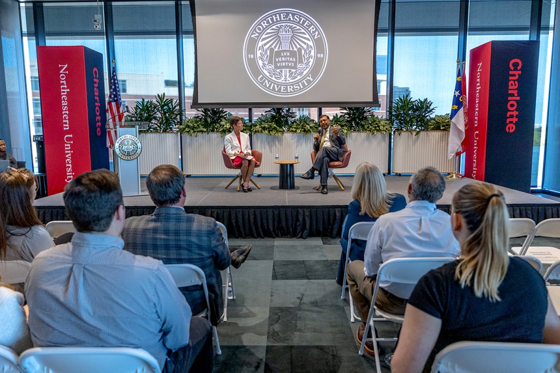 Dr. Rahul Gupta speaks on stage during a fireside chat.