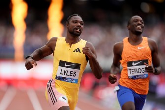 Noah Lyles winning the 100m dash in track.