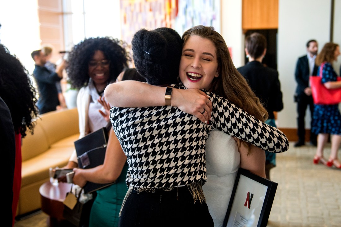 05/03/18 - BOSTON, MA. - Shannon Croatto, E'18, receives a hug during the Torch 8 graduation ceremony held on the 17th Floor, East Village on May 3, 2018. Photo by Matthew Modoono/Northeastern University