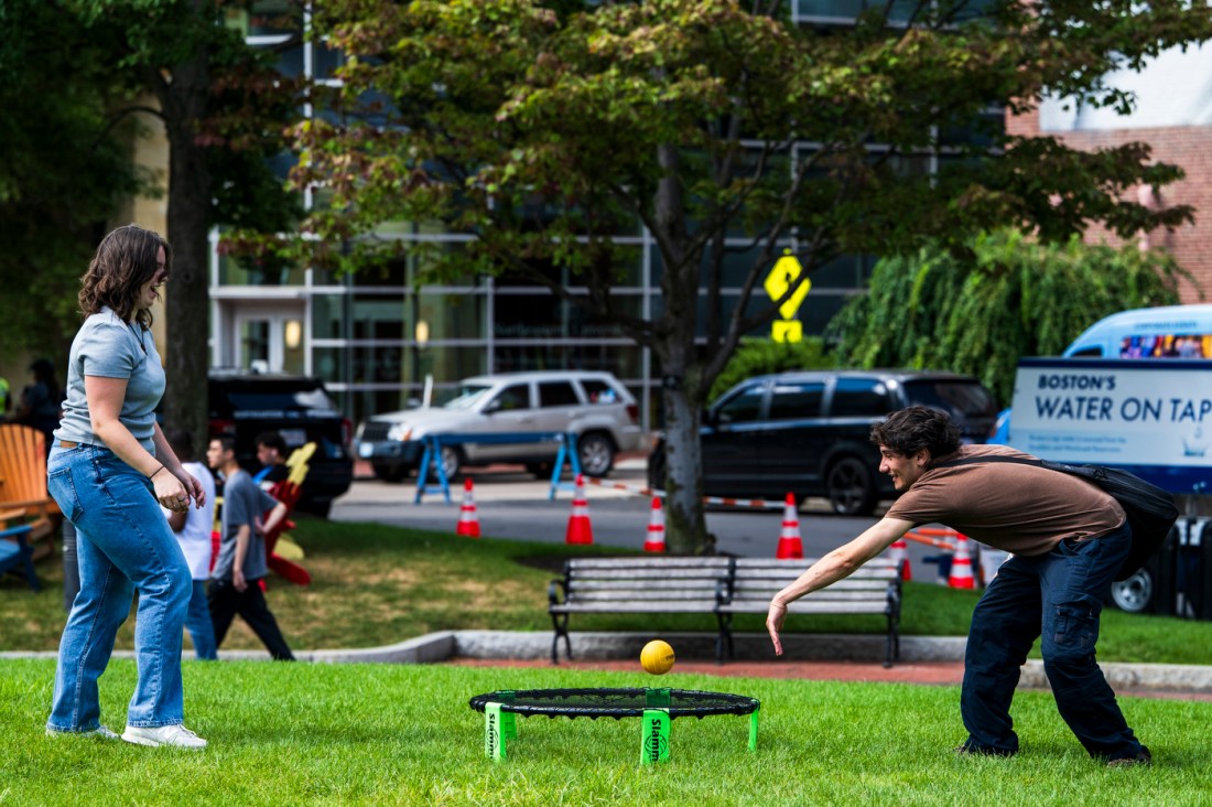 People play outdoor games on a sunny day.