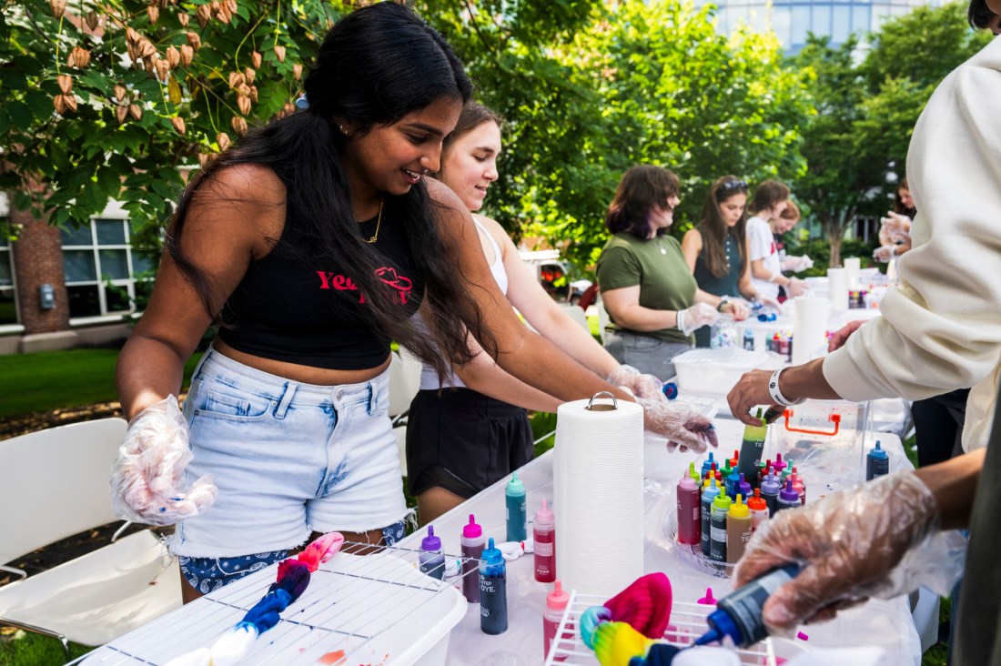 People tie-dye shirts together during Northeastern's Welcome Week.