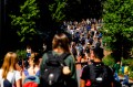 A crowd of students walking through the Boston campus.