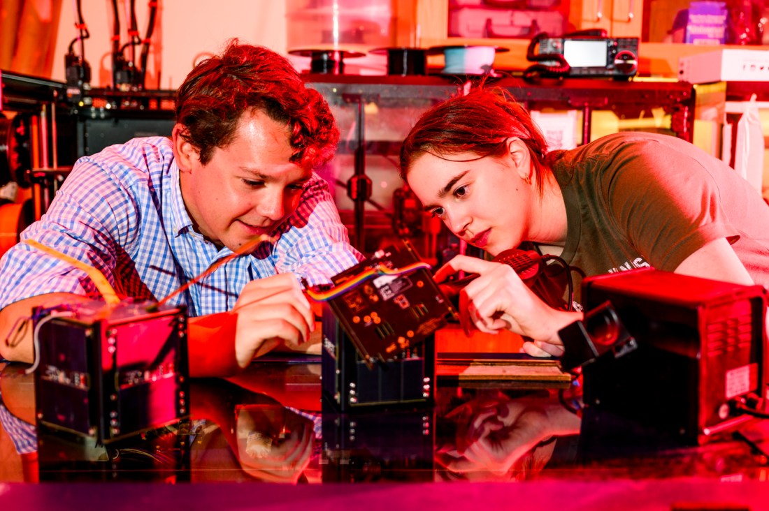 Matthew O'Rourke and Rachel Rakushkin working on a test box in the lab. 