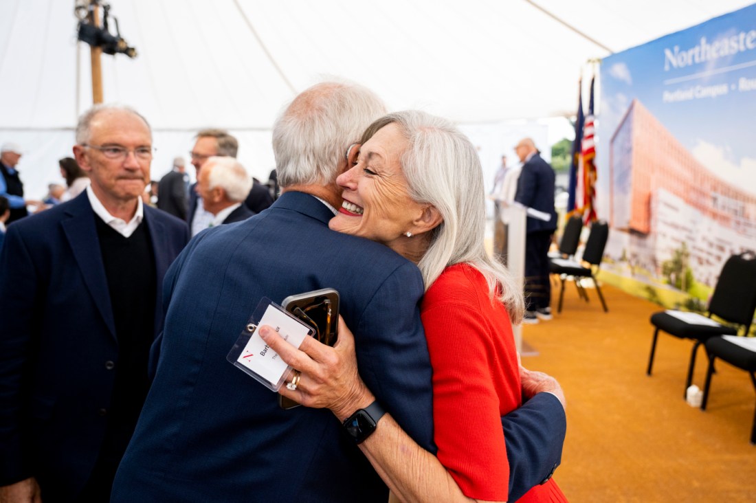 Barbara Roux hugging another person at the Portland ground breaking. 