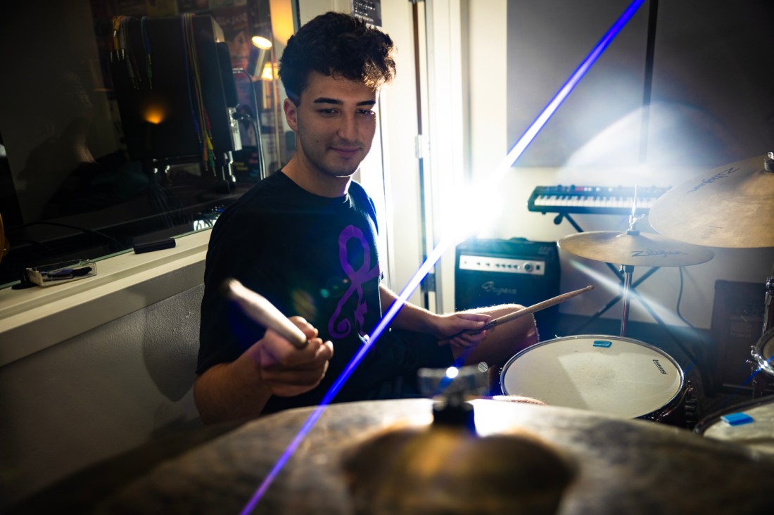 Jonathan Klopp playing the drums in the recording studio.