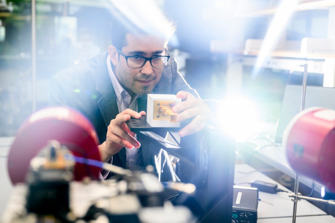 Joseph Jornet working in a lab in the ISEC building.