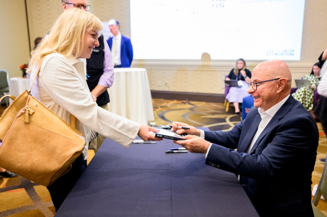 President Aoun receives an autographed copy of his book, 