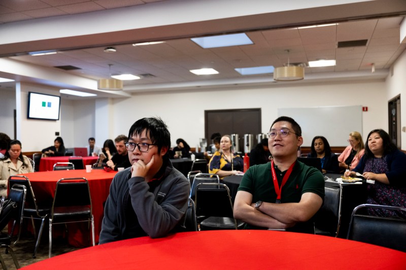 Students listen to Rebecca Carrier at a symposium.