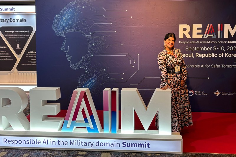 Denise Garcia posing at the REAIM Summit.