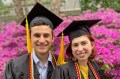 Matt Fishman and Ellesse Cooper wearing caps and gowns at graduation.