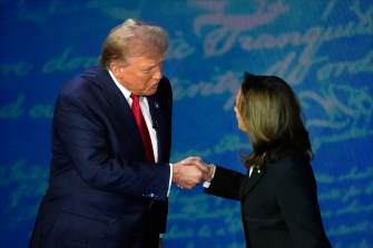 Kamala Harris shaking Donald Trump's hand before the debate.