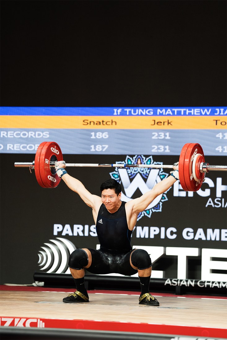 Matthew Tung competing at a weightlifting competition.