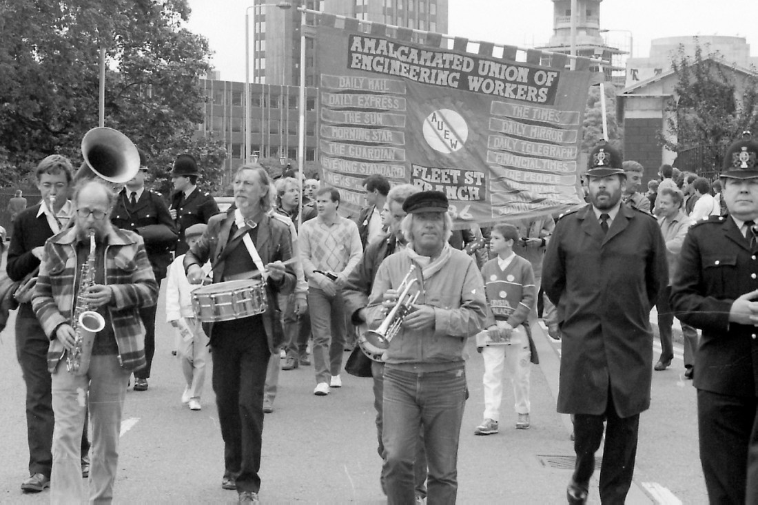 A black and white photo of union worker protestors. 