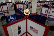 A person filling out a ballot during early voting.