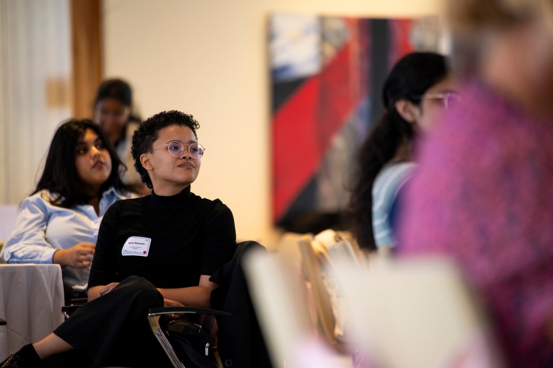 Audience members listening at the Women of the Cloud College Tour.