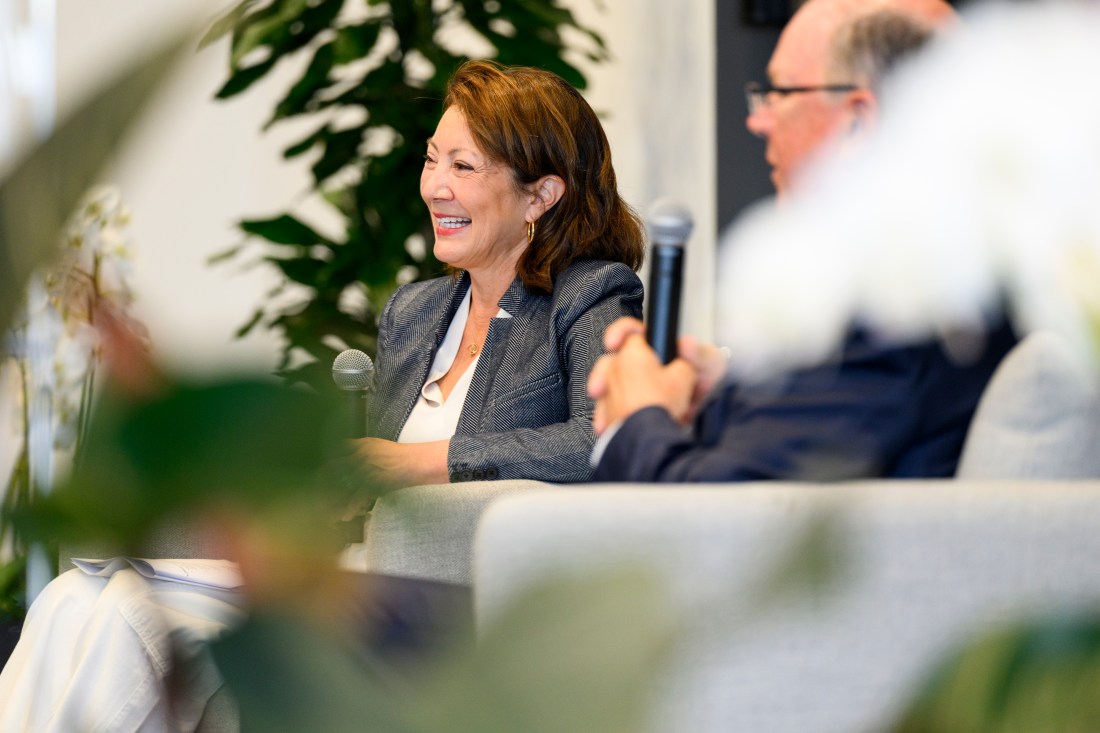 Diane MacGillivray sitting next to Alan McKim, smiling.