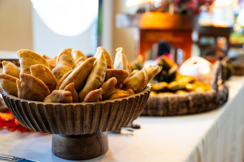 Food displayed in large bowls on a table.