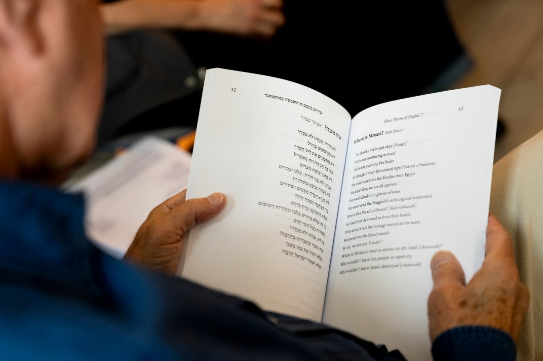 A person holds a pray book.