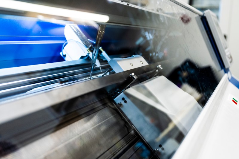 An automatic knitting machine.