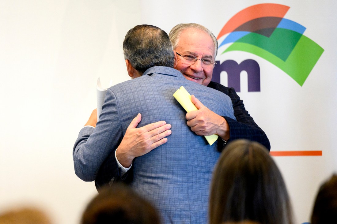 Aaron Michlewitz and Robert DeLeo giving each other a hug.