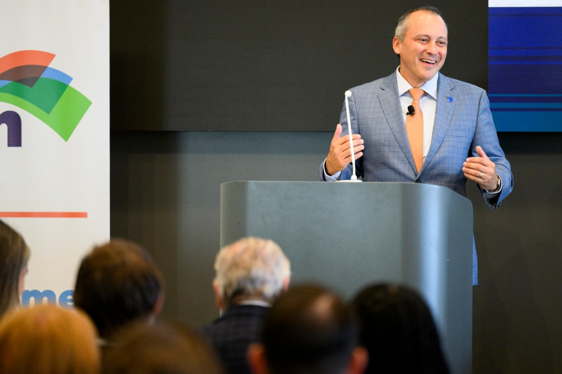 Aaron Michlewitz speaking at an event.