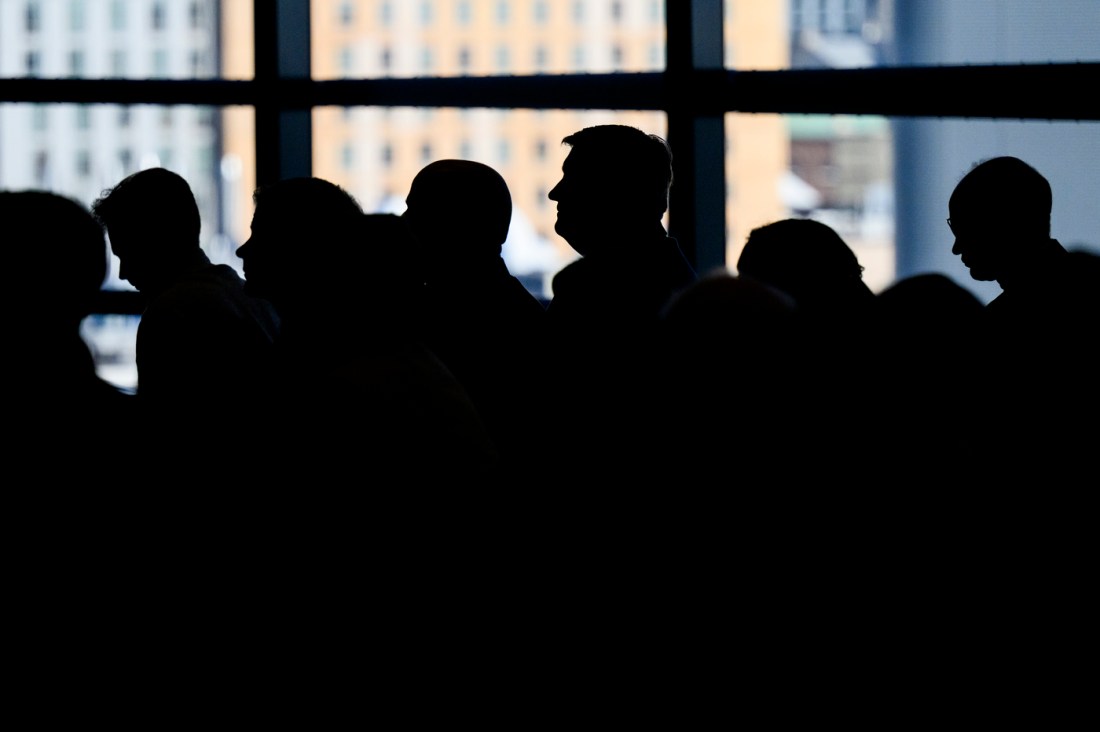 Silhouette of audience members at an event.