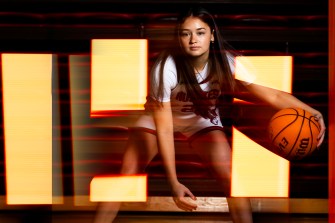 Maddie Vizza dribbles a basketball.