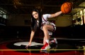 Maddie Vizza posing with a basketball