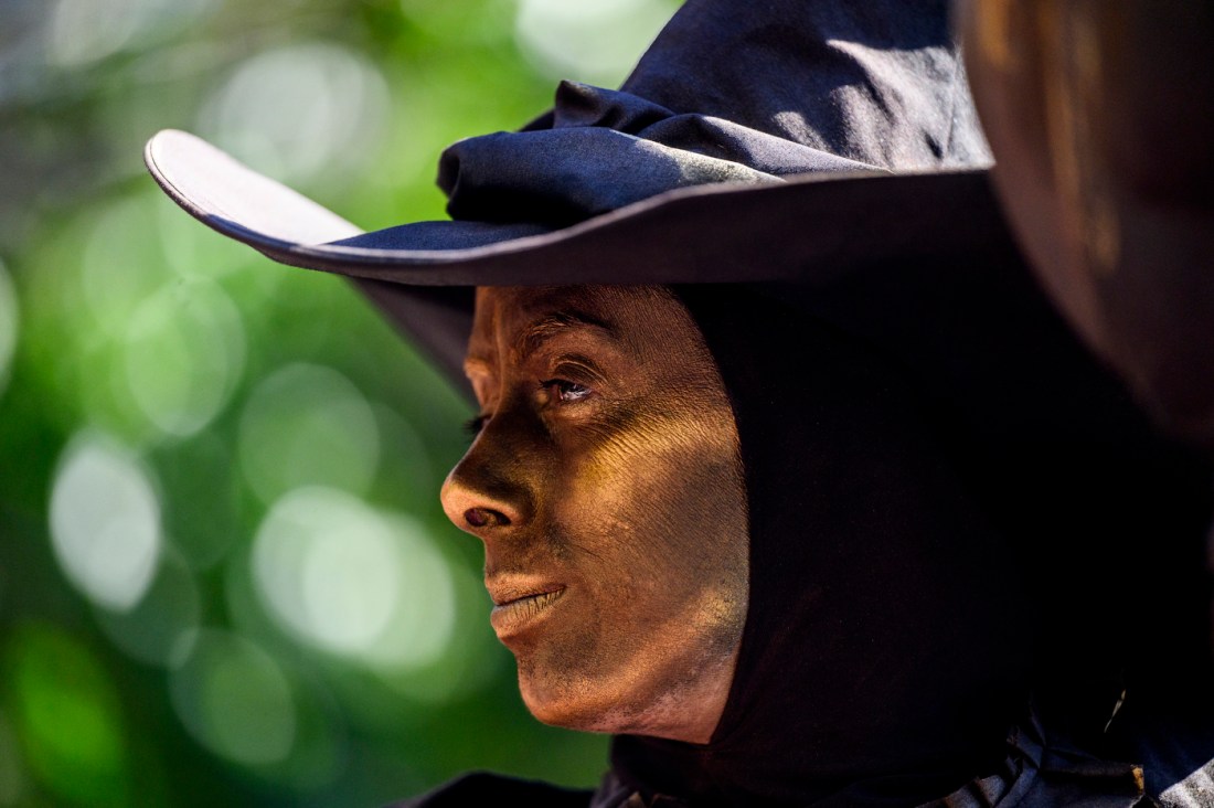 A person wearing a witch hat.