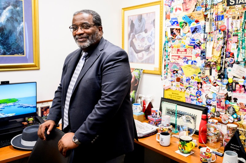 Robert Jose posing in his office.