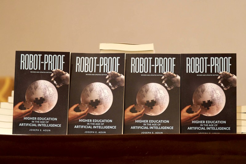 Four copies of President Aoun's book Robot-Proof lined up. 