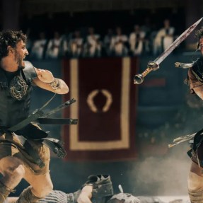 A screen capture from 'Gladiator II' of two gladiators fighting in an arena.