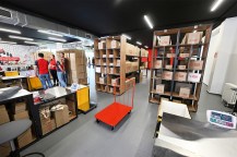 An inside look at a warehouse filled with boxes and furniture.